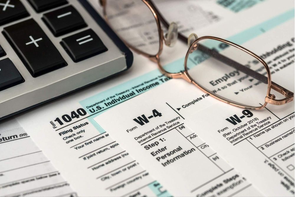 Glasses on tax form for financial planning