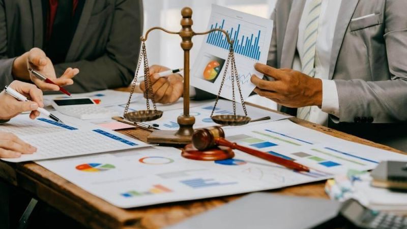 A group of people discussing accounting services for law firms