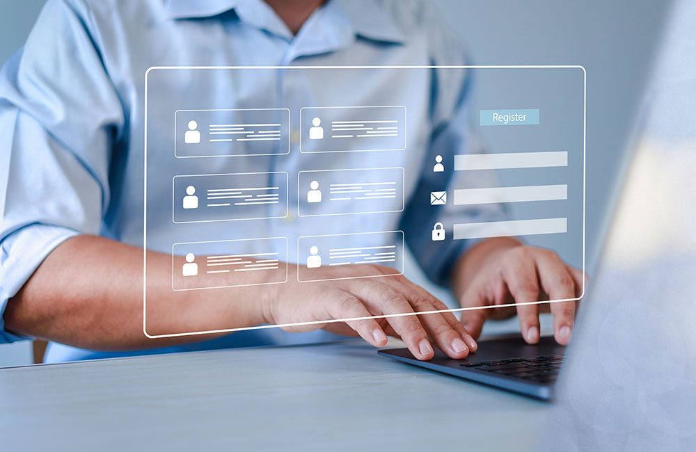Person typing on laptop with a virtual registration form overlay; login and register online concept.