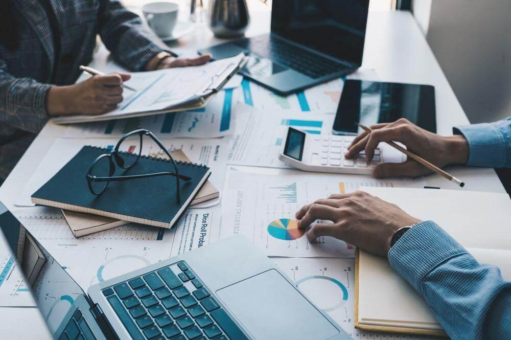 Group of clients reviewing tax planning documents