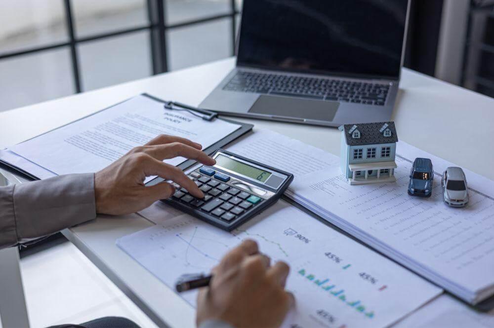 Person using a calculator for real estate tax